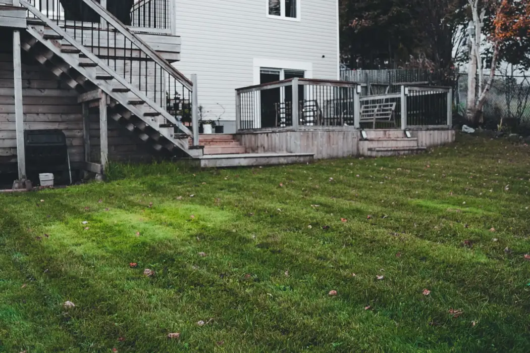 House with deck and lawn