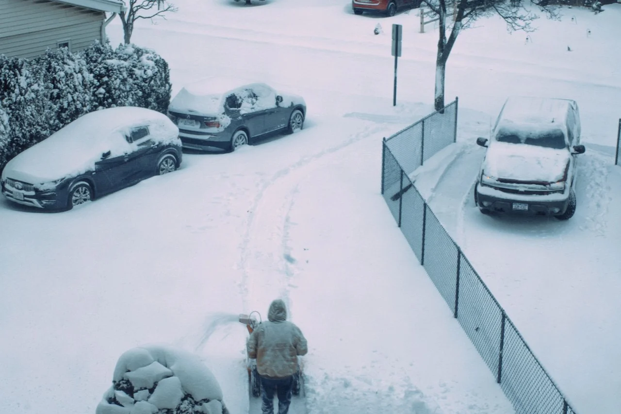 Shovelling a suburban driveway